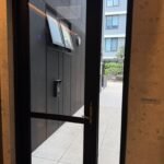 Clean glass entrance door at a strata property